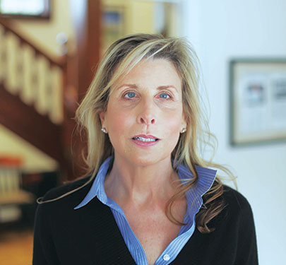 Christine A. Pulgini, Esq. '92, pictured, is an alumna of Curry College and member of the Board of Trustees.