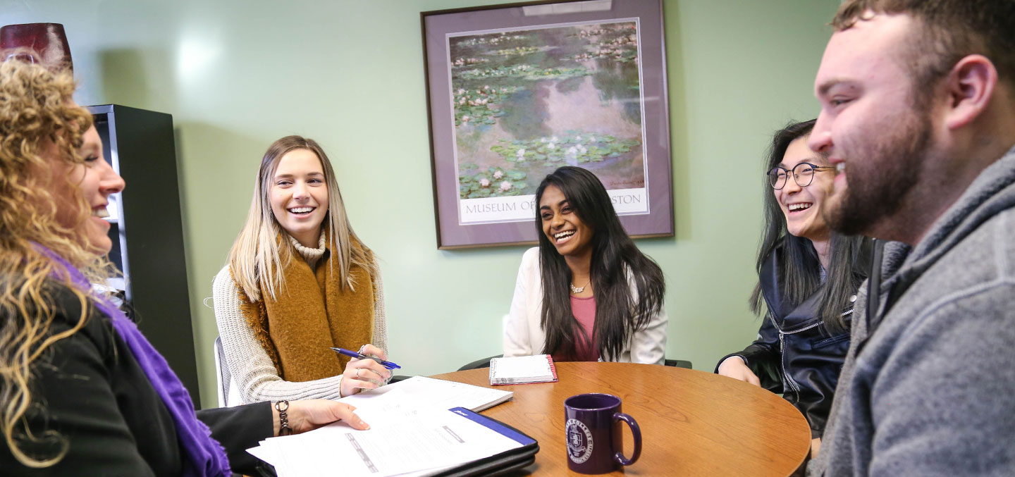 A Curry College Center for Career Development staff member provides students the service of a career advice group session
