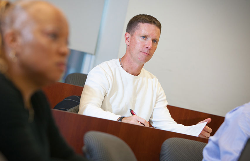 Curry College continuing education students in class representing the criminal justice degree program at Curry College