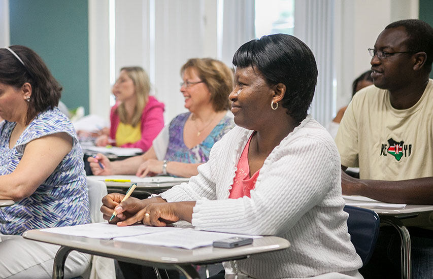 Curry College continuing education students in class representing the community health and wellness degree program at Curry College