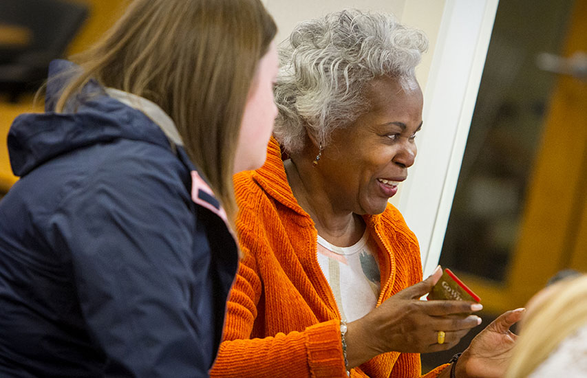 Curry College students work with seniors at a nearby community representing the Gerontology Certificate
