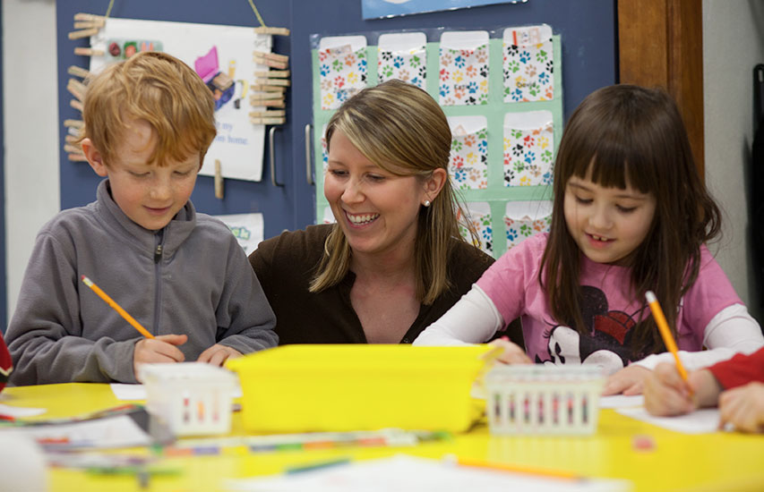 A Curry College Master of Arts in Criminal Justice Degree in Elementary Education alumnus teaches her young students