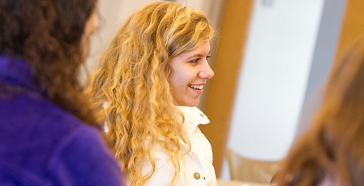 A student in the Curry College Honors Program participates in a discussion in class