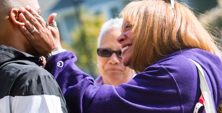 A First-Year parent hugs her son on the first day of Curry College