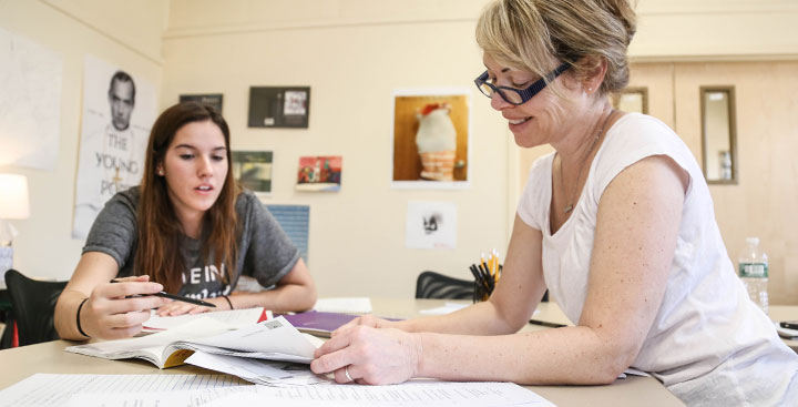 A PAL professor guides a PAL student during a one-on-one session