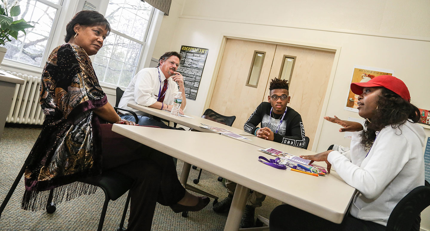 Program for Advancement of Learning (PAL) faculty members assist students in a group session