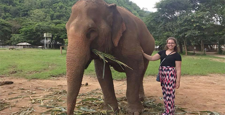Jackie Cotter '19 poses with an elephant in Chiang Mai, Thailand