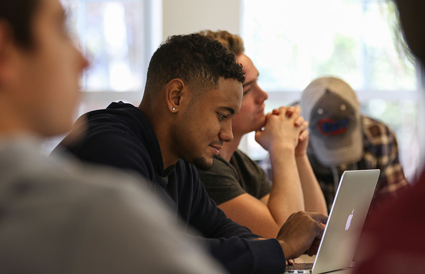 Student in class pursuing a Management Information Systems Minor at Curry College
