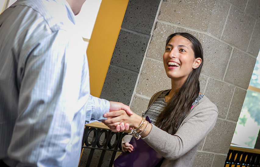 Student networking as part of her Public Relations Concentration at Curry College