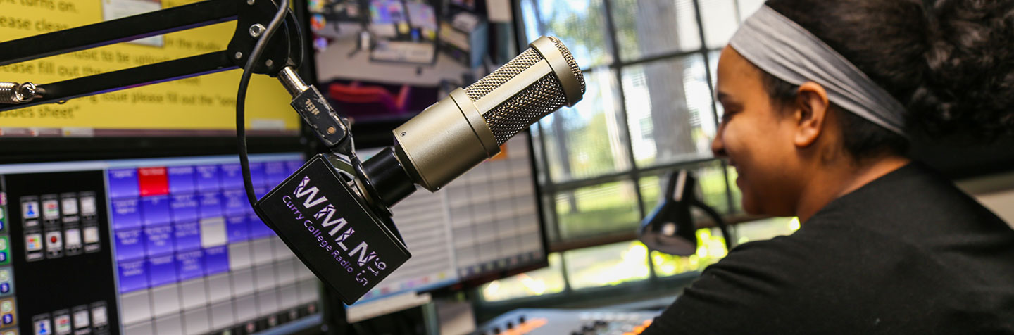 Curry College WMLN student doing her own radio show