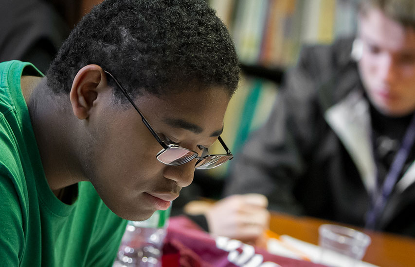 Curry College student reading, representing the American Literature concentration