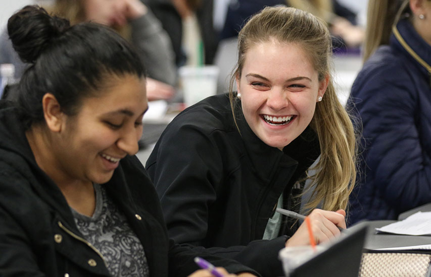 Curry College students pursuing a Community Health and Wellness Degree collaborate in class