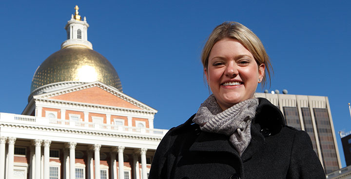 Student standing outside the Massachusetts State House, repesenting the Politics anbd History Degree at Curry College