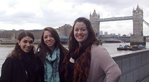 Curry College Students Studying abroad in London, pose in front of London Bridge