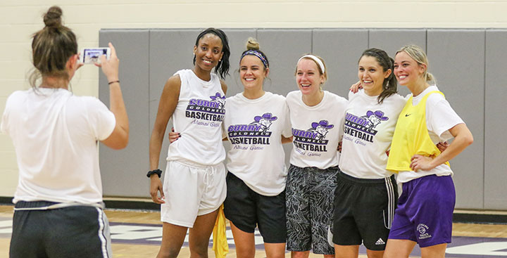 Women's Basketball players pose for a photo at the Alumni Reunion Game