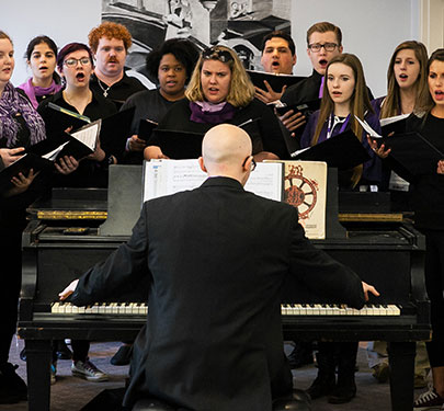 Members of the choral group SING! perform on campus