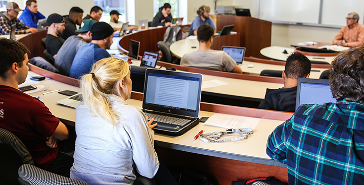 Students attending class in a lecture hall on campus