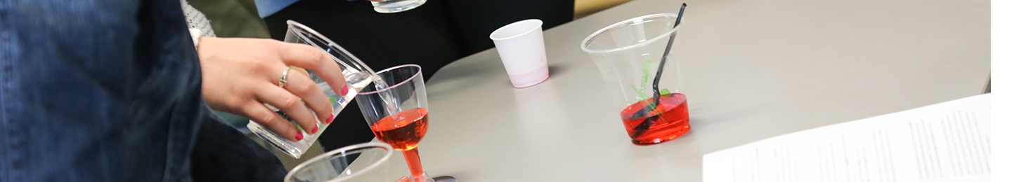 Pouring drinks as part of an educational exercise