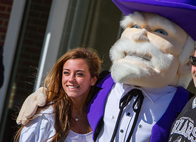 Student poses with the Curry College Colonel